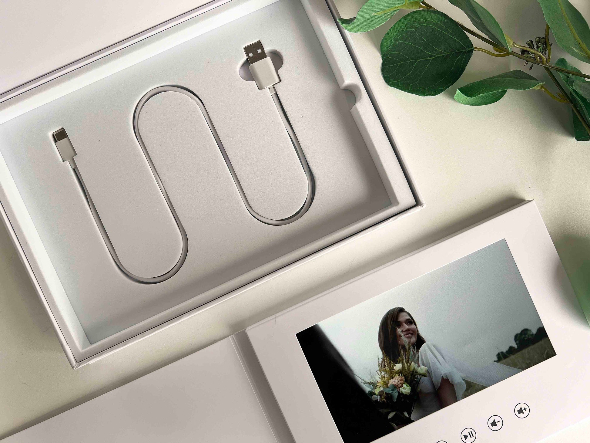 Memory Vault video book closeup image with video book and its charging cable USB-C packed in a box