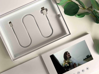 Memory Vault video book closeup image with video book and its charging cable USB-C packed in a box